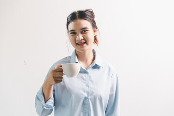 Asian woman rejoicing, looking happy, champion, fist pump gesture, standing over white background....