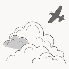 Gray airplane flying through fluffy clouds aircraft