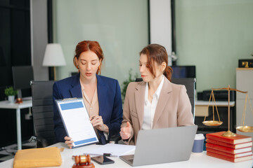 business people and lawyers discussing contract papers sitting at the table. Concepts of law,...