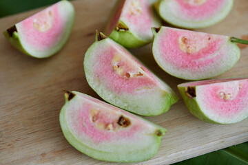 Fresh ripe guava fruit on cutting board