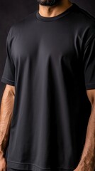 Black Short Sleeve Shirt on Male Model Against Dark Background