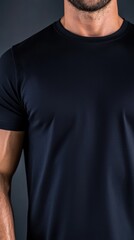Close-Up of Male Chest and Arm in a Dark T-Shirt Against Background