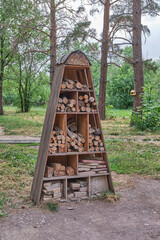 Triangular Wooden Insect Hotel in Forest Park
