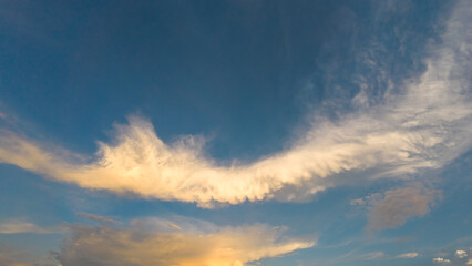 White Clouds in Blue Sky at Sunset