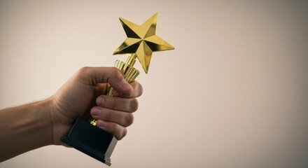 Hand holding a golden star-shaped trophy against a light beige background