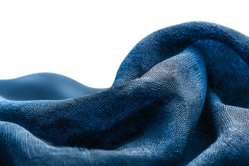 Textured fabric with deep blue hues drapes gracefully, creating a visually striking contrast.