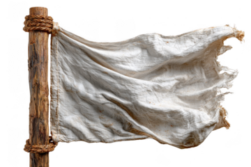 A weathered white flag fluttering on a wooden pole, symbolizing surrender or truce.