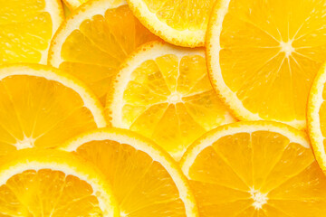 Slices of fresh oranges as background, closeup