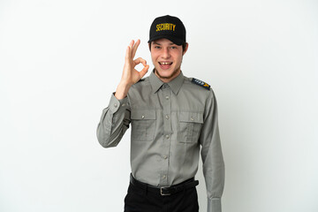 Young Russian security man isolated on white background showing ok sign with fingers