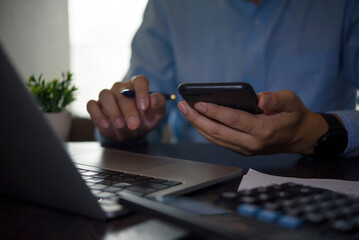 Man hands holding phone, remote work, online learning, mobile banking, digital lifestyle, home...