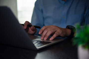 Businessman working on laptop, remote work, online learning, digital communication, professional...