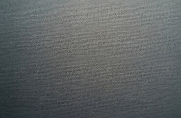 Close-up of grey linen fabric texture, natural textile with a subtle woven pattern. This seamless background features a finely threaded surface, suitable for upholstery, apparel, or wallpaper.