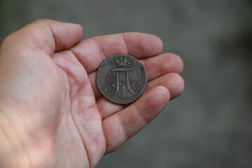 Antique Russian copper coin in hand