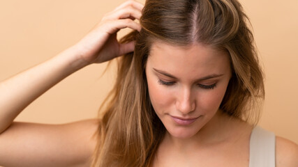 Fototapeta premium Portrait of blond pretty woman over isotaed background