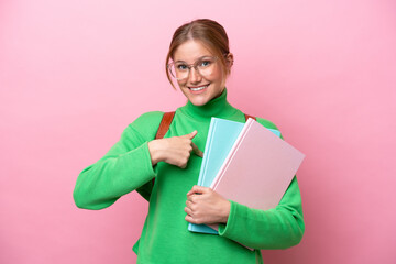 Young caucasian student woman isolated on pink background with surprise facial expression
