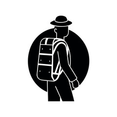 Silhouette of a man with a backpack and hat against a dark background