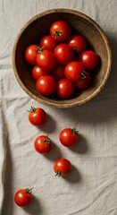 Fresh tomatoes in wooden bowl