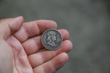 Fototapeta premium Old coin half dollar in hand