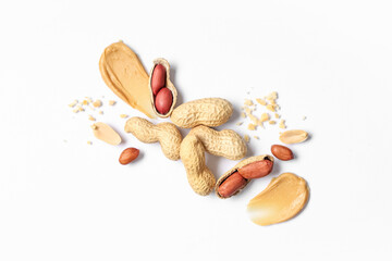 Composition with peanuts and smears of butter on light background