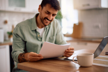 Close up of man going through home finances.
