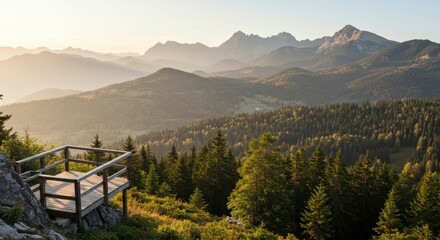 Panoramic sunset view of layered mountains, forests, and a wooden viewing platform