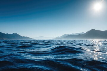 Naklejka premium Realistic photo of the sea surface with a blue color and smooth waves, with the sun rising
