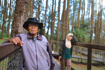 Senior Couple Relaxing in a Tranquil Forest Setting