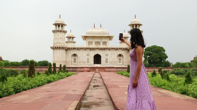 Tourist taking selfie in Itmad-Ud-Daulah's Tomb in Agra, India