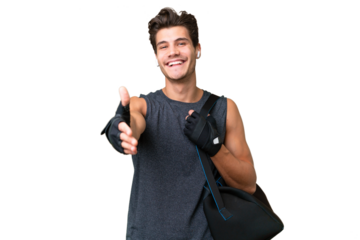 Young sport caucasian man with sport bag over over isolated background shaking hands for closing a good deal