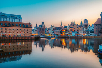 Gdansk with Motlawa river in Poland. Old town colourful house with Zuraw or crane and with Holy Spirit Gate