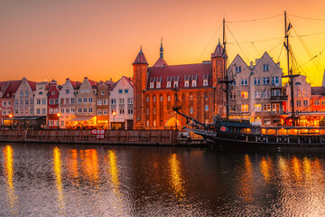 Fototapeta premium Gdansk with Motlawa river in Poland. Old town colourful house with Stragania Gate