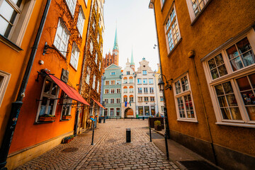 Fototapeta premium Gdansk with Motlawa river in Poland. Old town colourful house with saint Marys church i main square.