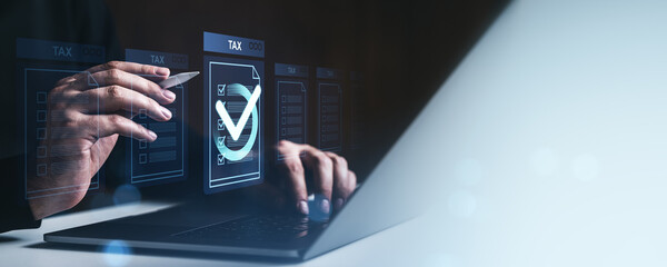 Digital tax form submission concept with holographic checklist and hands using stylus and laptop on...