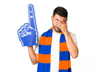 Young caucasian sports fan man over isolated chroma key background with tired and sick expression