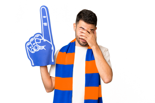 Young caucasian sports fan man over isolated chroma key background with tired and sick expression