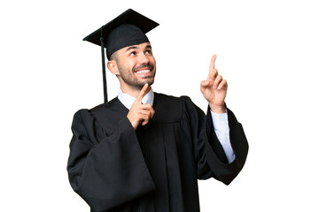 Young university graduate man over isolated chroma key background pointing with the index finger a...