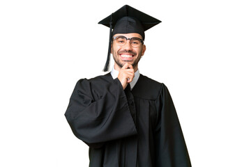 Young university graduate man over isolated chroma key background with glasses and smiling