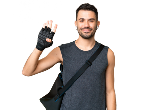 Young sport caucasian man with sport bag over over isolated chroma key background happy and counting four with fingers