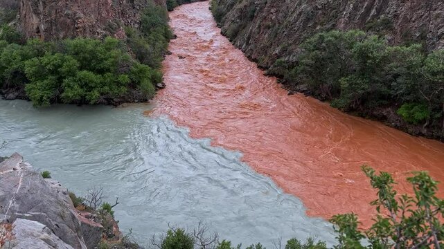 Confluence of the two rivers different colors Chu and Chon-Kemin into one. Kyrgyzstan travel destination