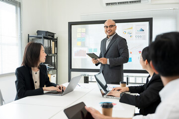 Asian business people team analyzing statistics financial. Group Team of ceo business man and woman Meeting Conference Discussion various topic. Executive professional managers Corporate in office.