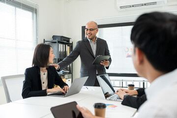 Asian business people team analyzing statistics financial. Group Team of ceo business man and woman Meeting Conference Discussion various topic. Executive professional managers Corporate in office.