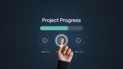 A hand is pressing a button on a screen that says "Project Progress." Concept of accomplishment and progress, as the person is actively working towards completing a project