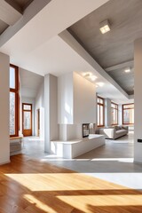 Modern spacious living room with sleek white design and natural lighting