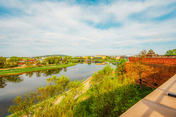Wawel castle landmark with city view near river in Krakow Poland. Autumn landscape on coast river Wisla