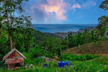 View from Kalim Mountains of Patong Beach in the island of Phuket Thailand, turquoise blue waters of the Andaman and lush green mountains