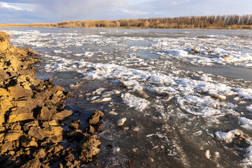 spring landscape, broken ice goes along the river. ice drift along the river
