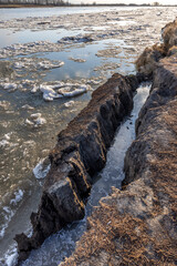 spring landscape, broken ice goes along the river. ice drift along the river

