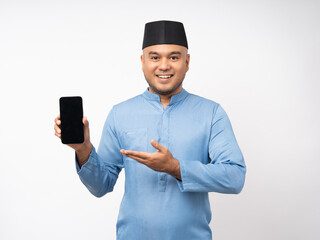 Muslim asian man standing using smartphone on isolated white background. Happy Portrait of cheerful smiling islamic asian man holding cell phone. People and lifestyle