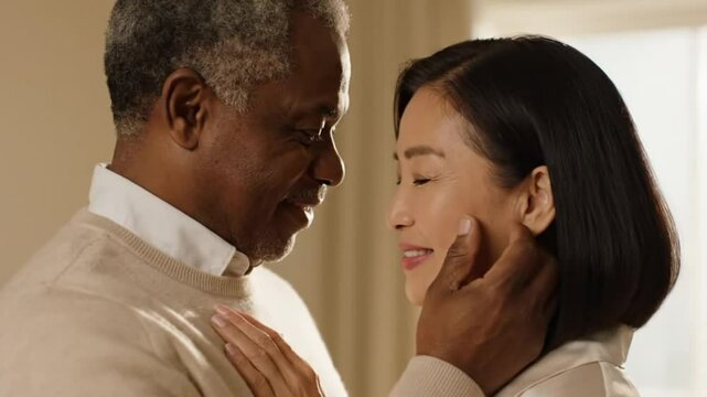 Portrait of a mature couple, African American and Asian lovers, they love each other and are full of affection