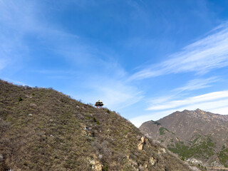 China. Traditional Chinese pavilion on a hillside. Great wall viewpoint. Rocky mountain landscape